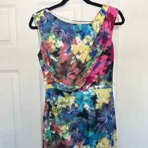 Floral print dress, pegged style with draping on the boddess.